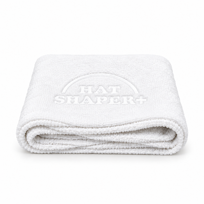 White Hat Shaper+ microfiber towel for wiping away excess dirt and cleaning foam after scrubbing baseball caps.